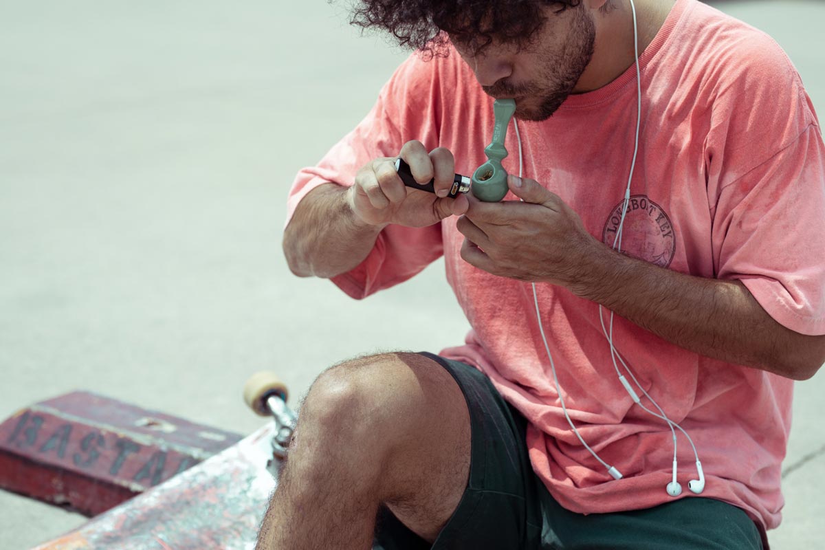 a man having a quick smoke of marijuana